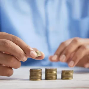 A picture of a man counting coins