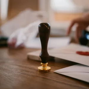 A notarial seal on a desk with papers